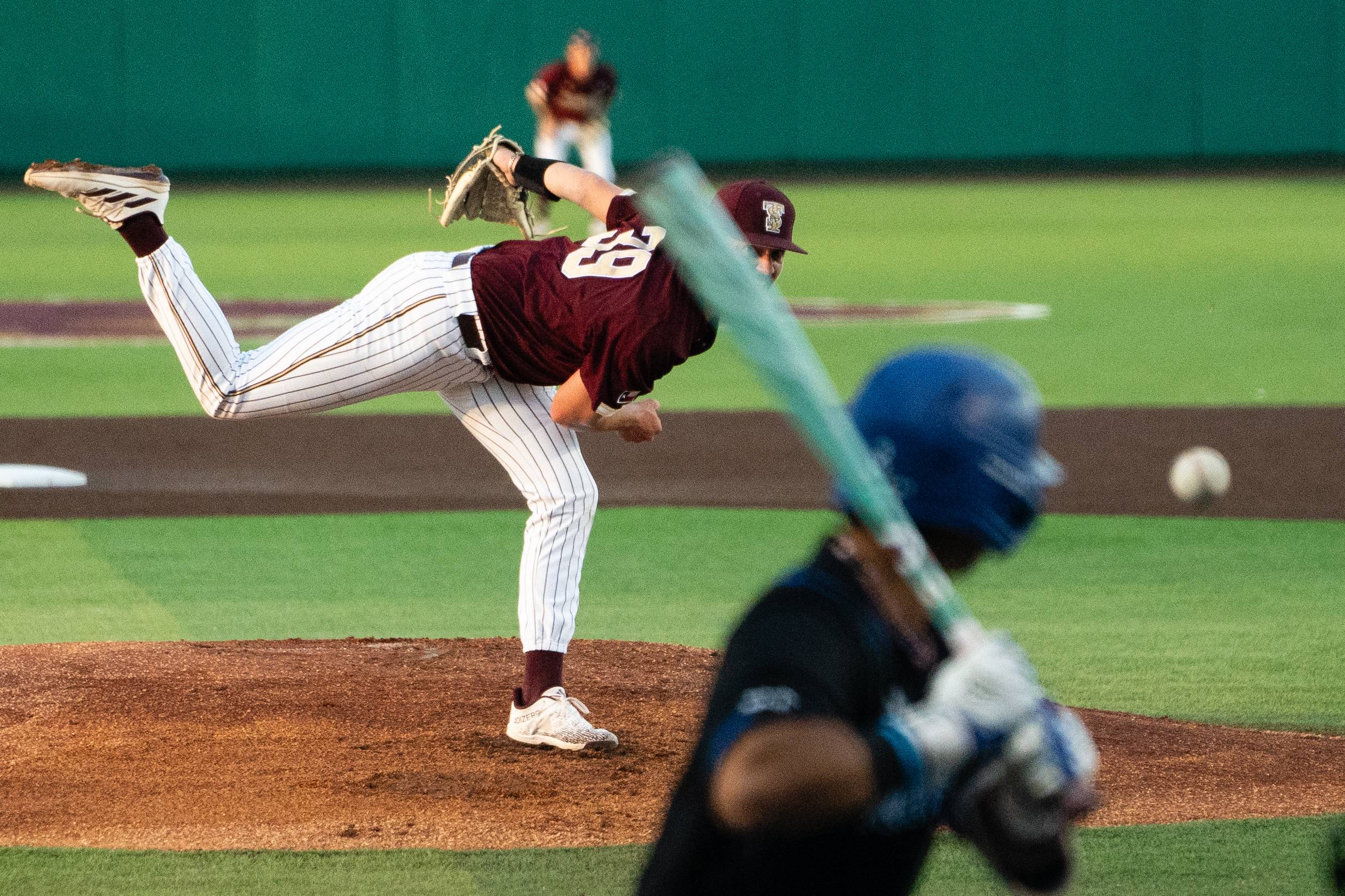Baseball Player Throwing a Pitch