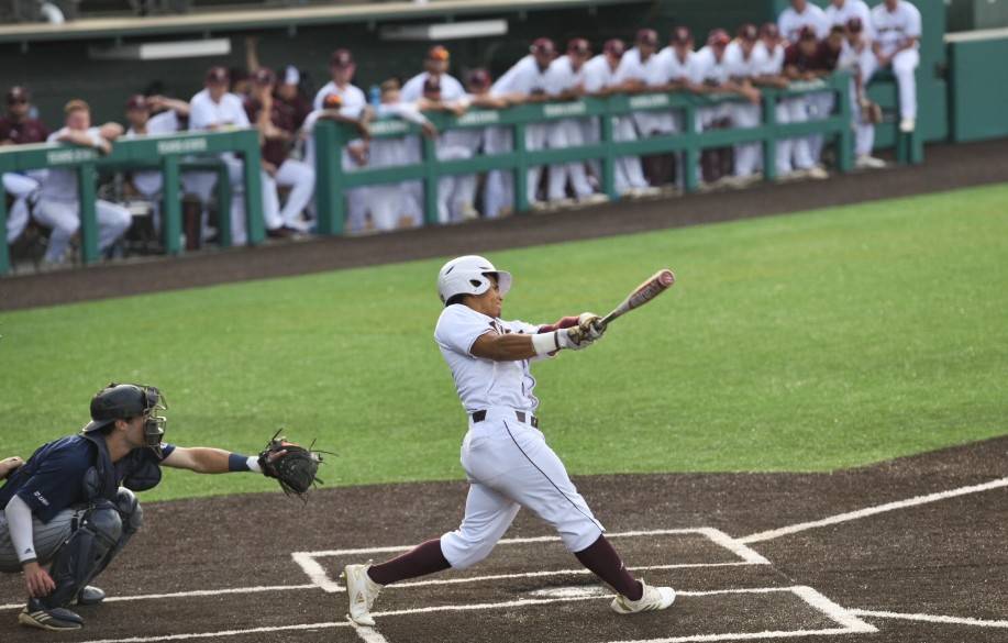 Baseball Player hitting a ball