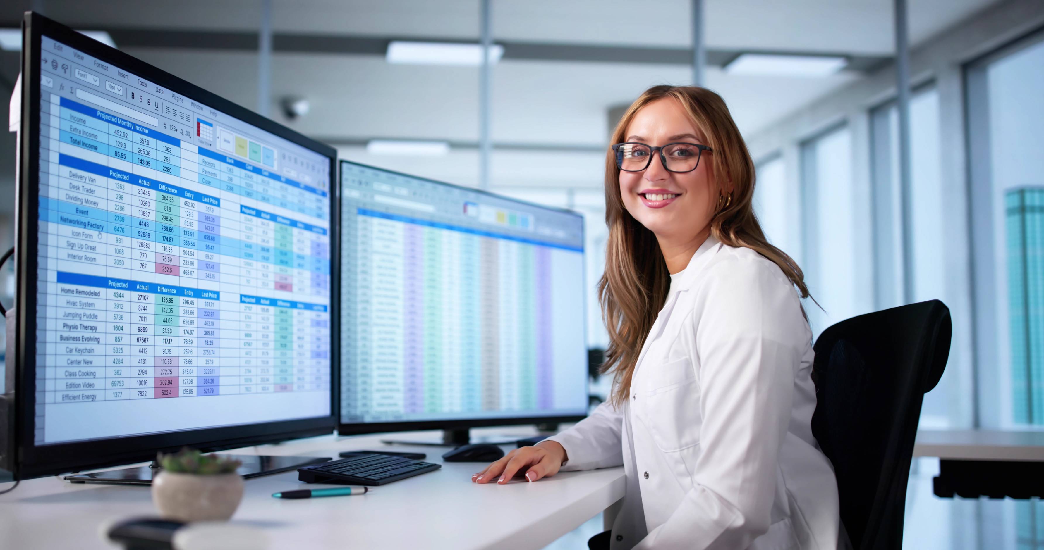 a nurse sitting at a computer station in a hospital