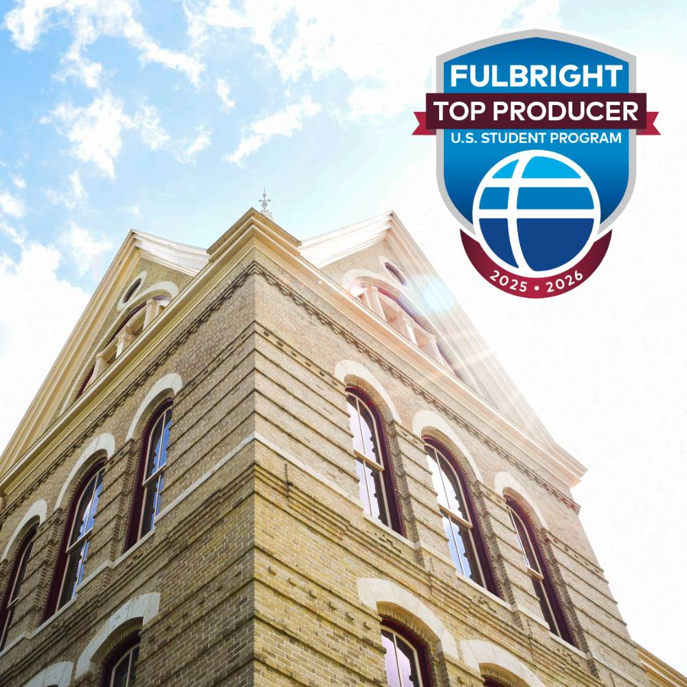 Photo of Old Main with the Fulbright logo on the top right corner