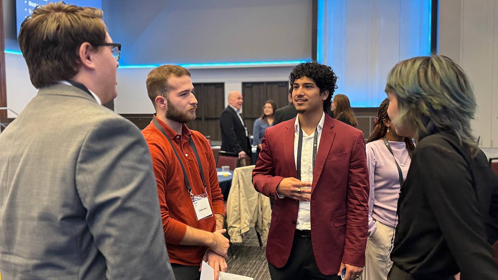 four students talking during an ice break session at the inaugural McCoy Leadership Summit