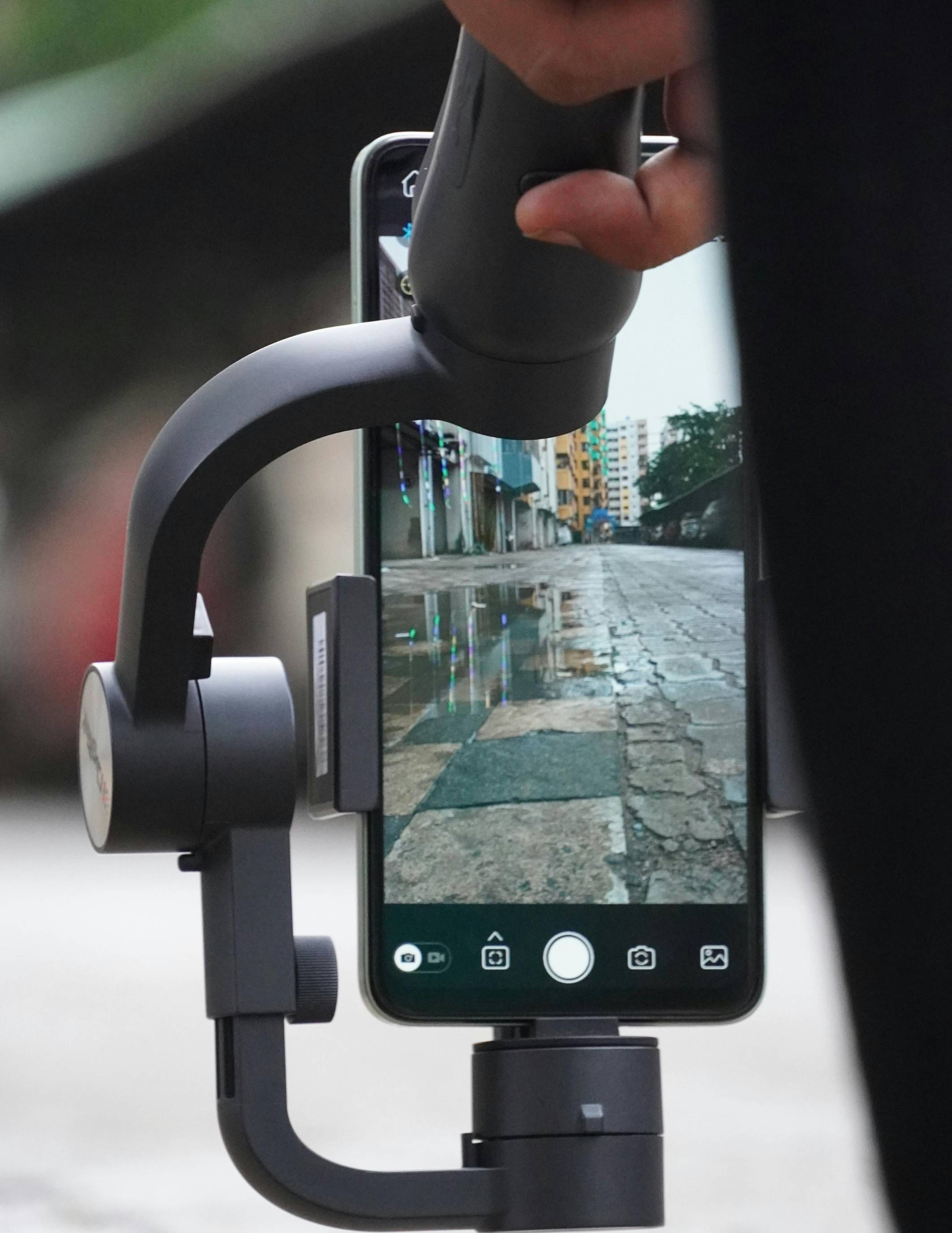 an iphone in a cradle used for filmmaking