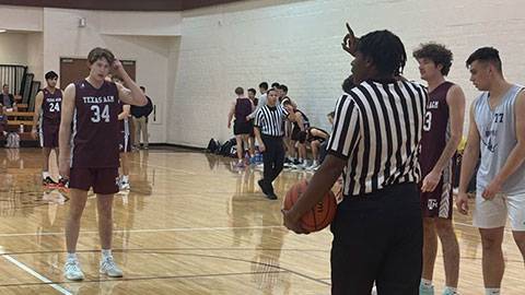 Camren Hinton officiating men's basketball