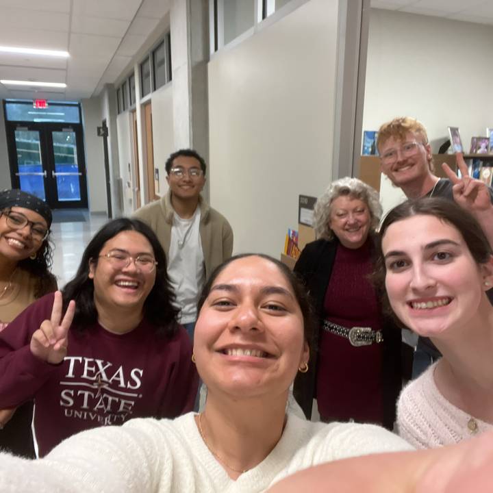 A group of people taking a selfie