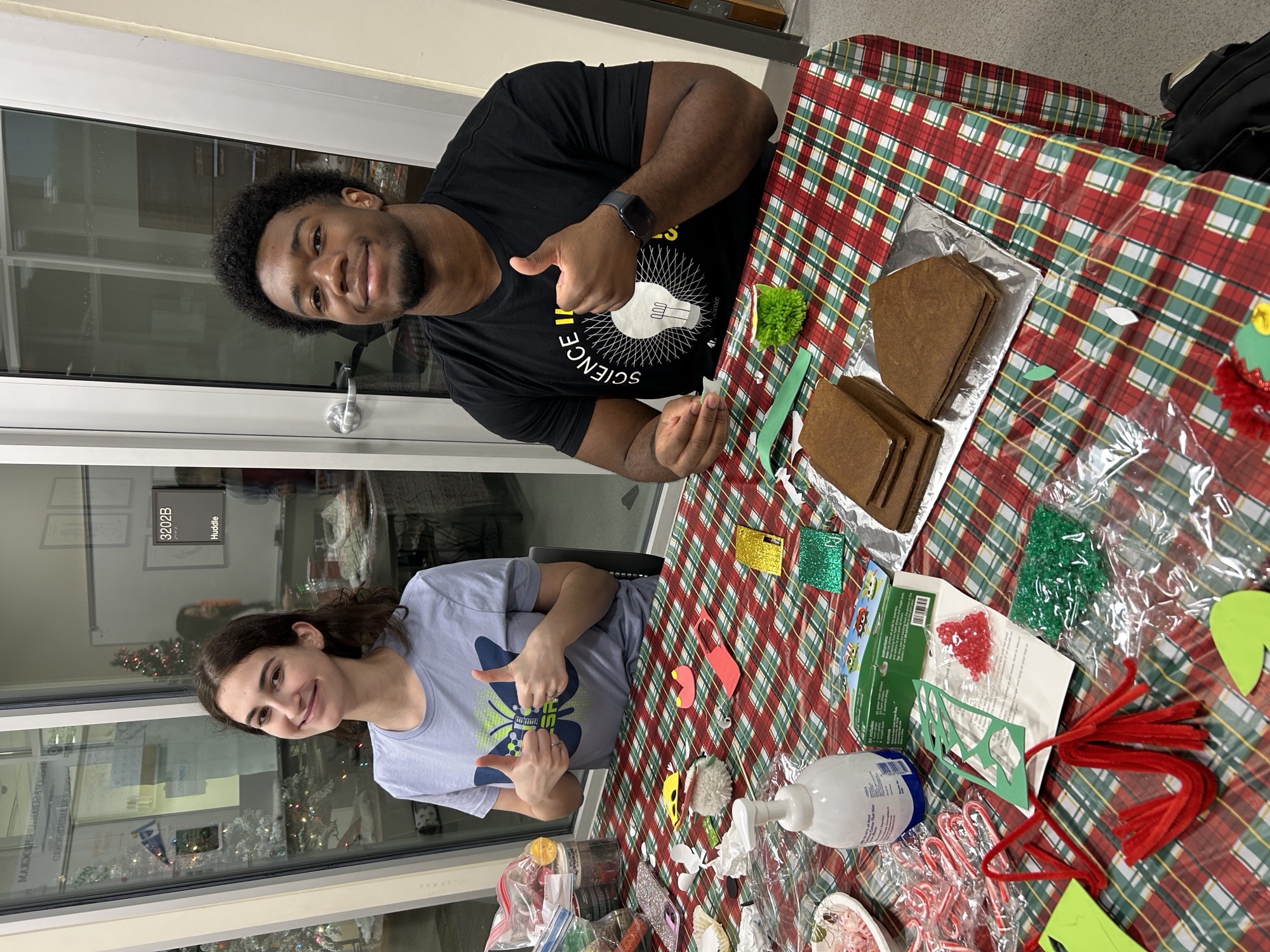 A boy and a girl sitting at a table