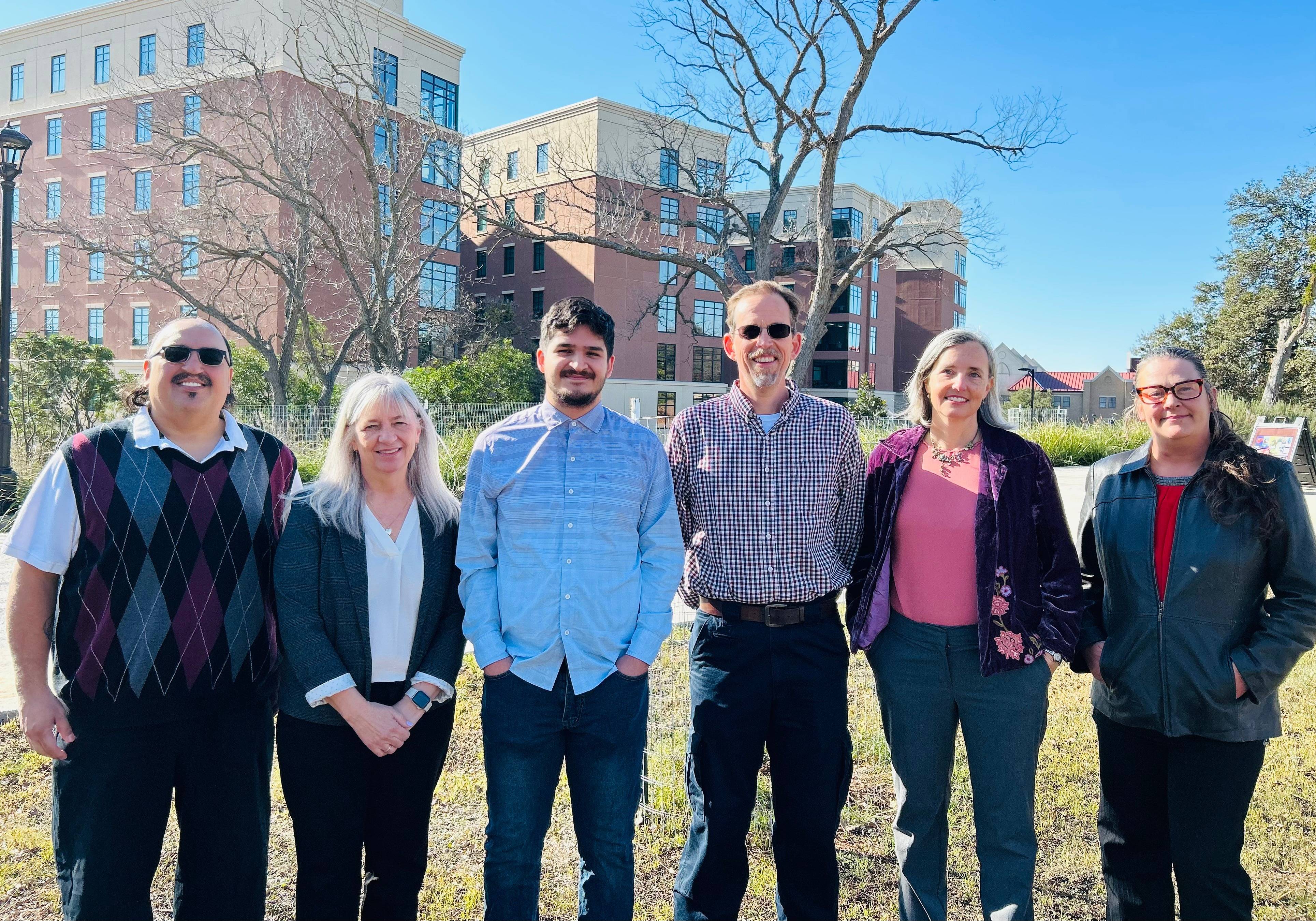 The CRO team standing outside of the Roy F. Mitte Building