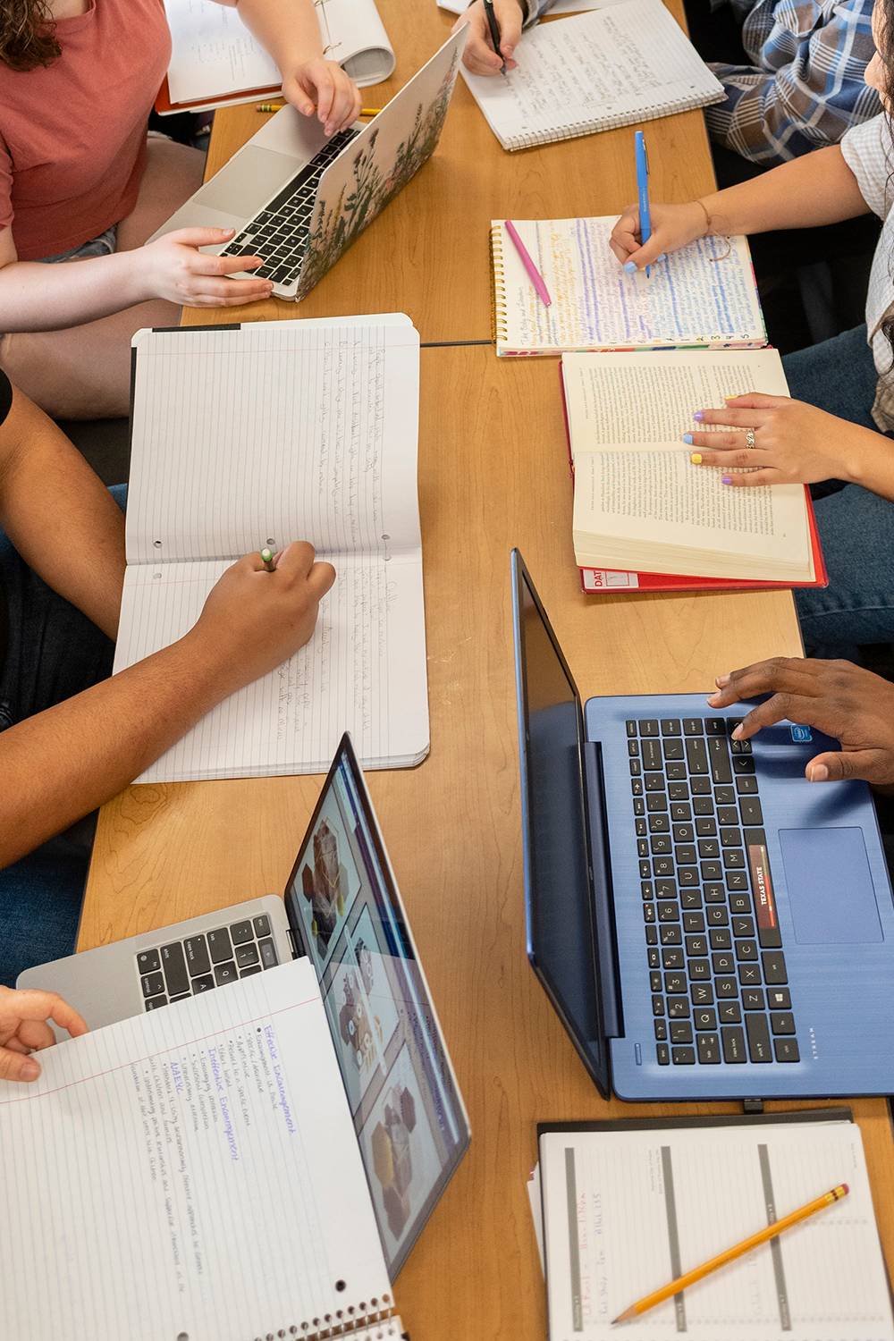 Students gathered around a table