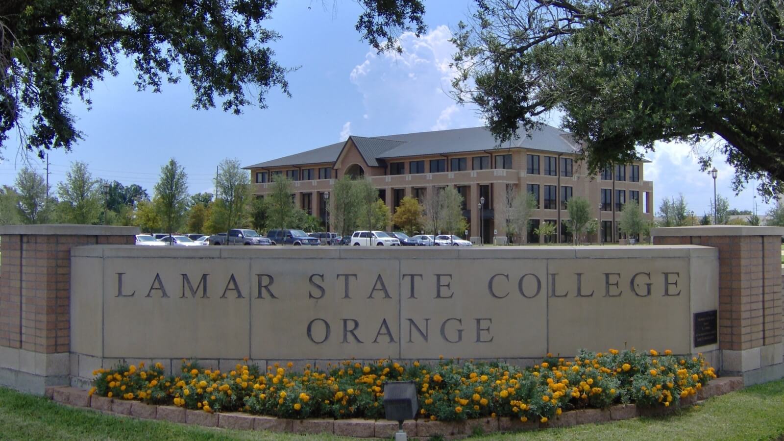 exterior photo of a building and signage on the Lamar State College Orange campus