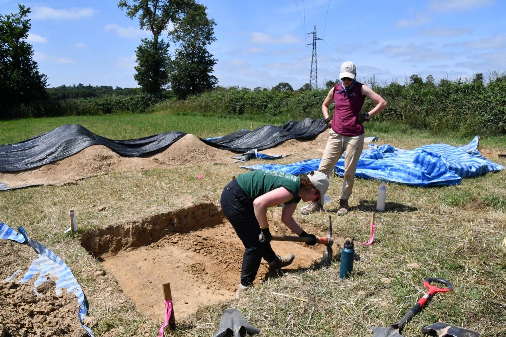Researchers digging at an archaeological site.