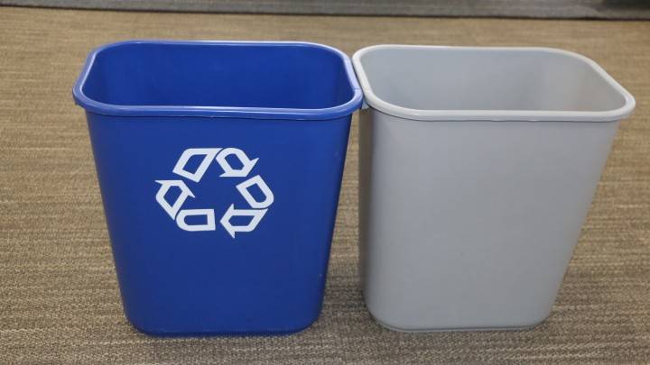 A recycling bin and a normal trash bin