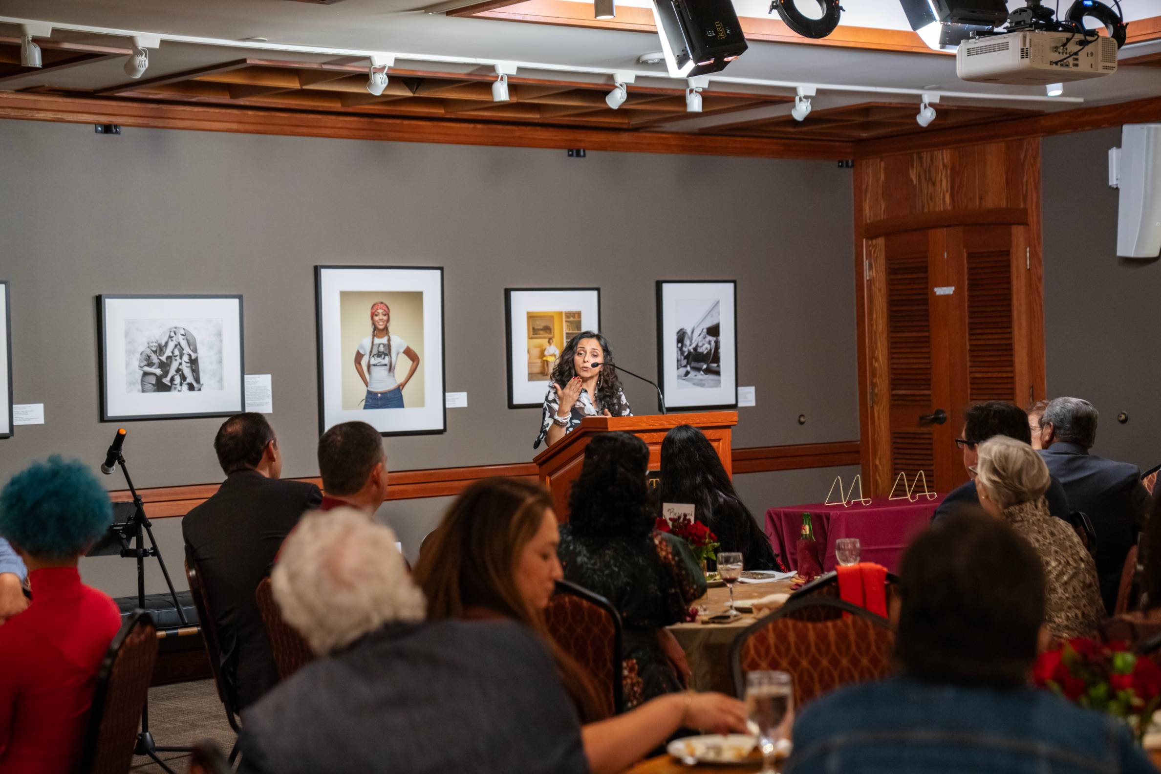 a person speaking at a book awards ceremony