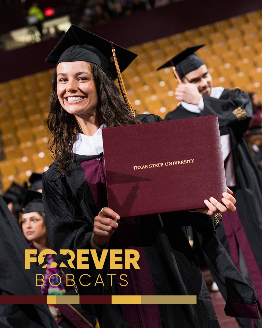 Student smiling at graduation with her diploma with the Forever Bobcat logo overlayed on the photo