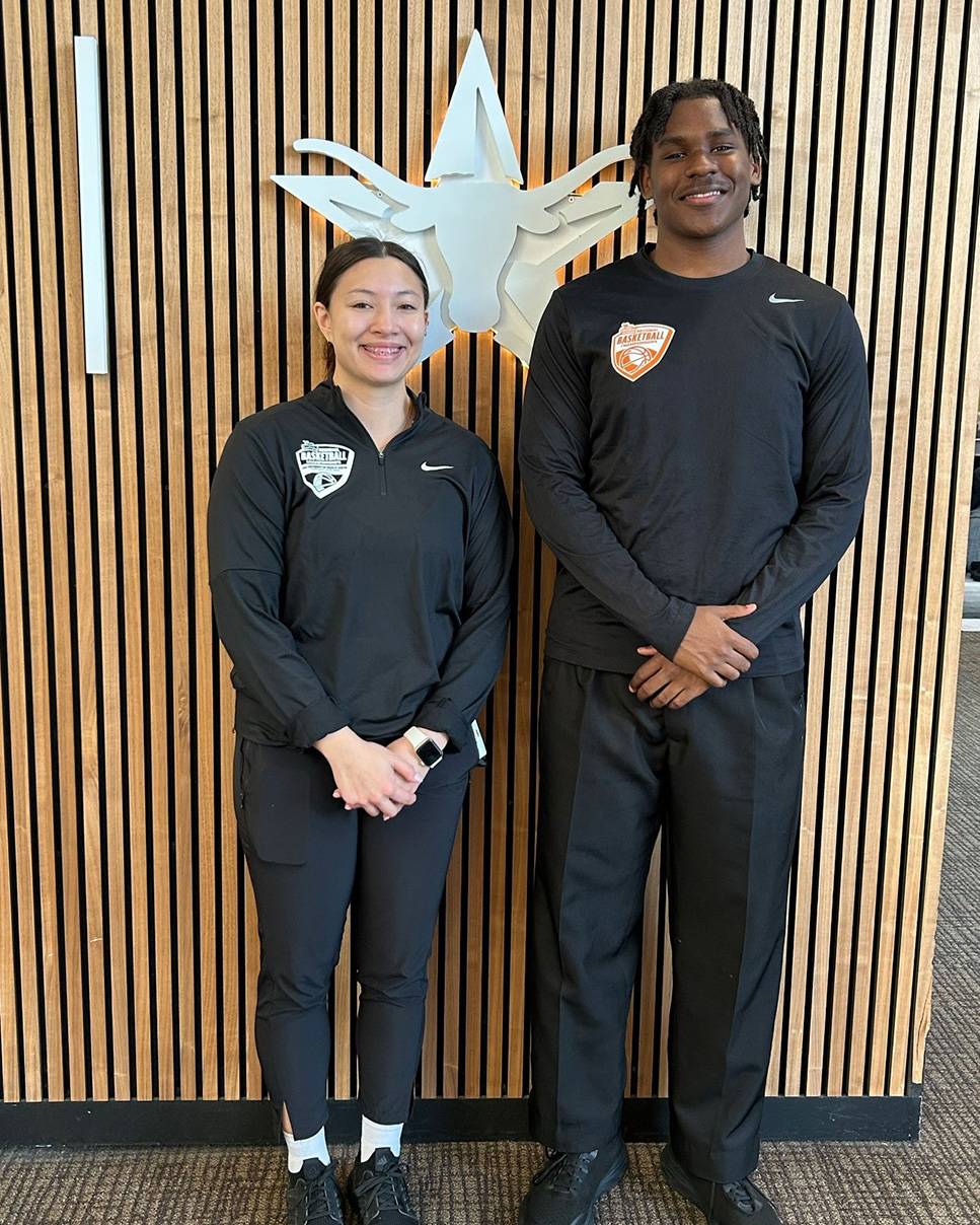 Carmen Hinton (right) poses for a photo next to another official.