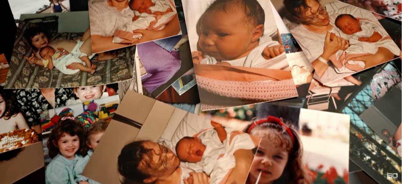 Photos of Emily Nash throughout her childhood scattered on a table