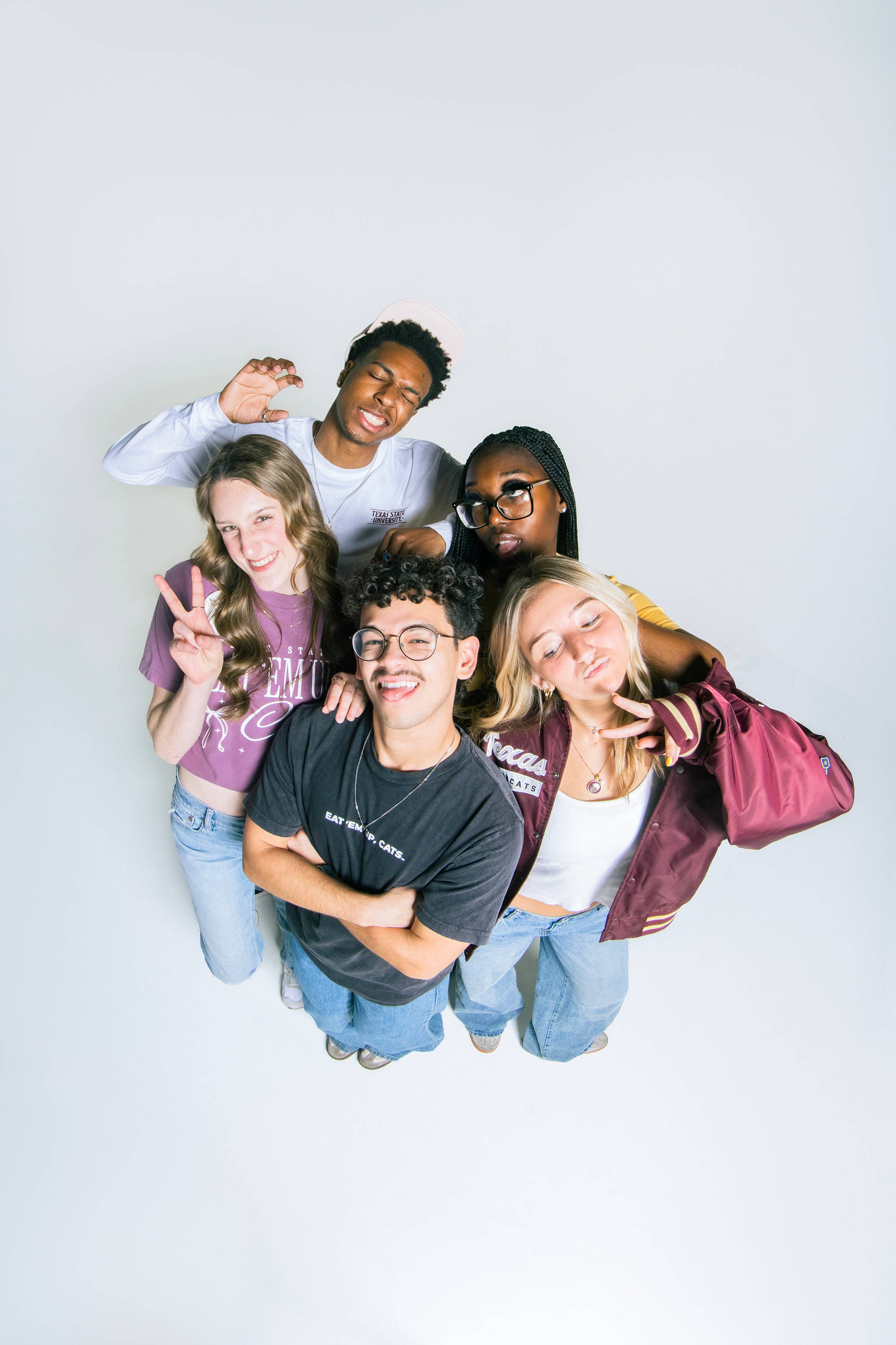 video of five students individually showing themselves in a slowmo 'glambot' style video