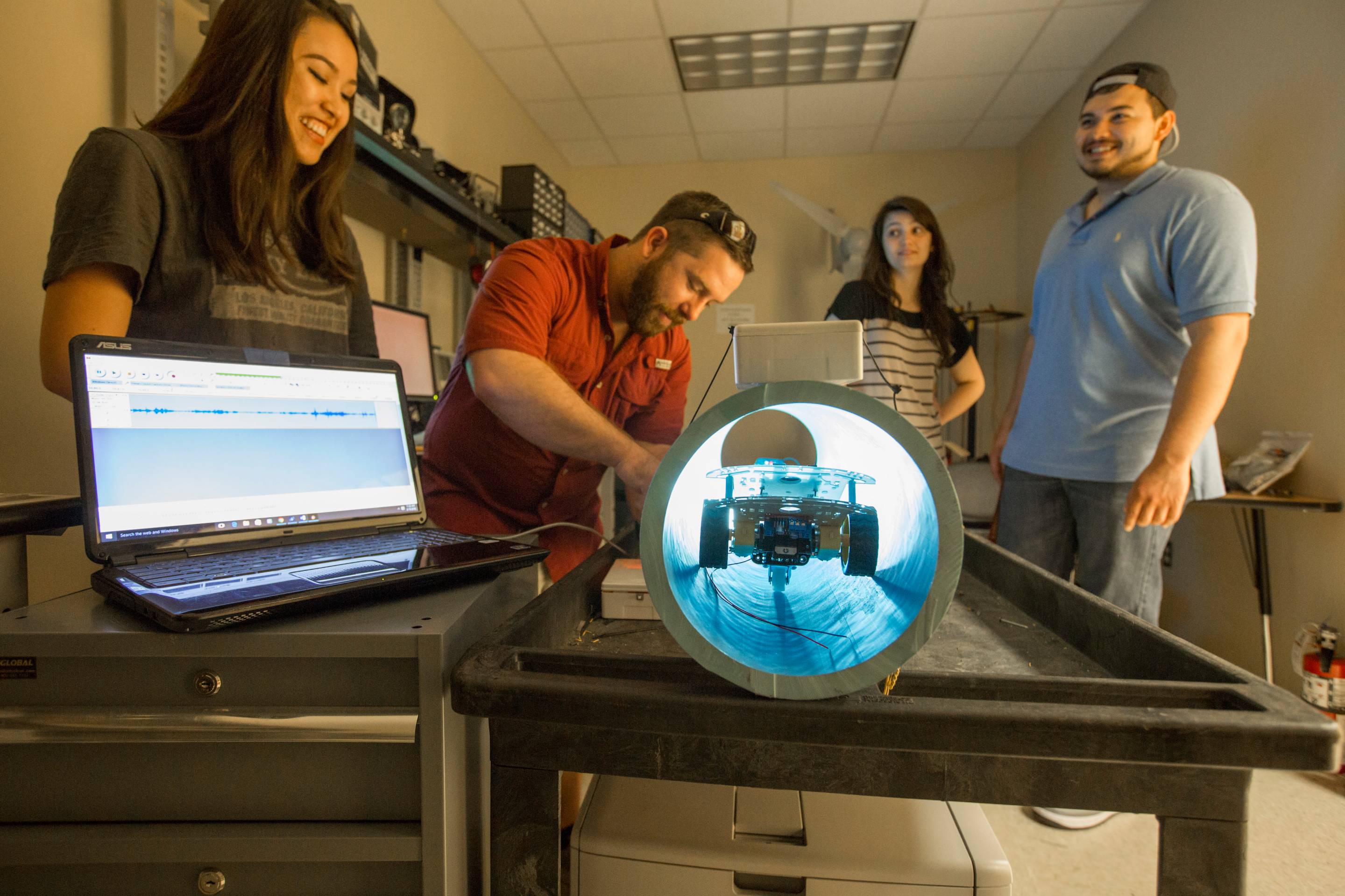 TXST researchers with computer and scope