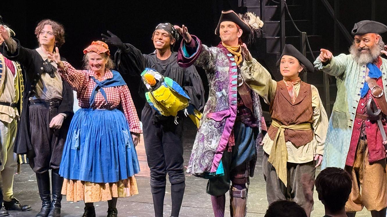 Students in the theatre program bow to the audience after their performance.