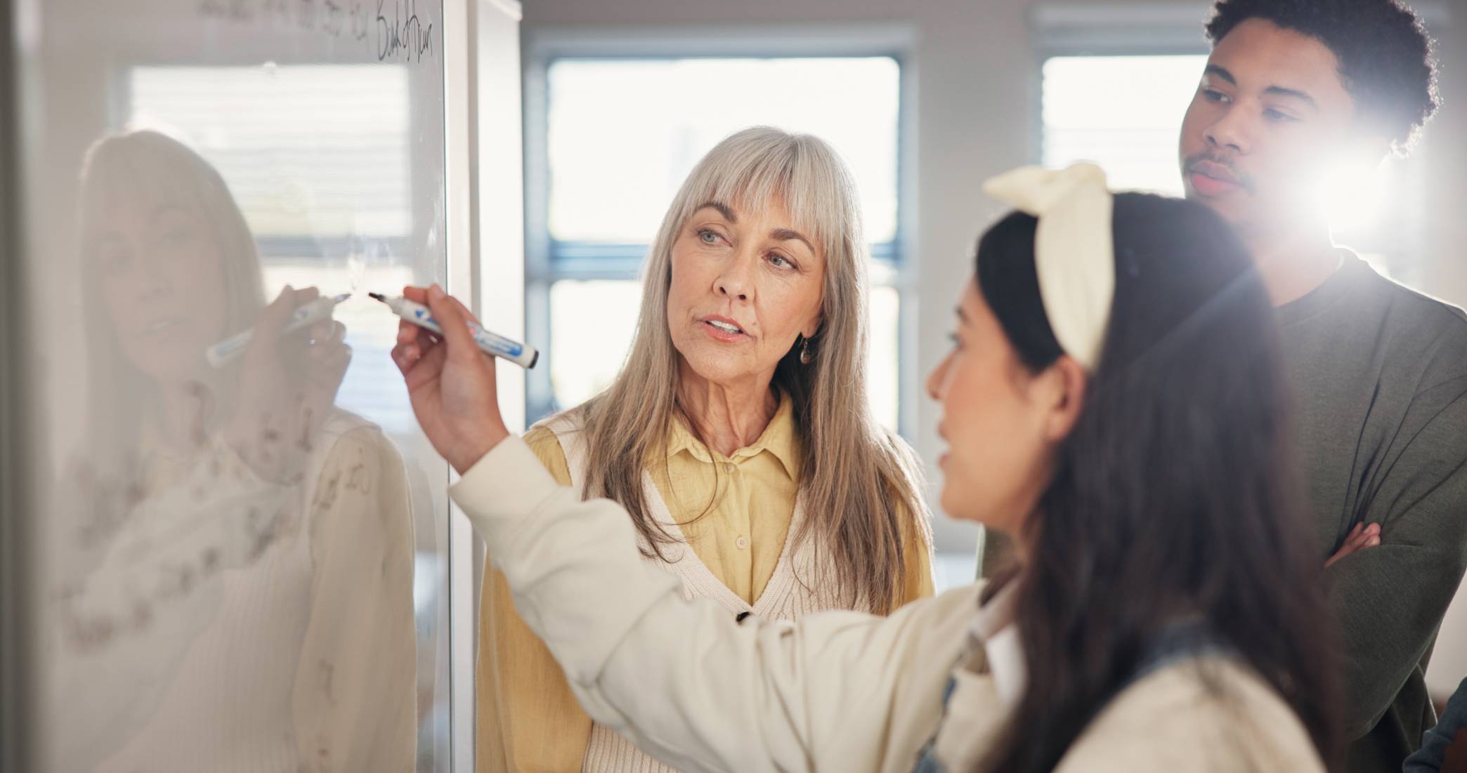 a teacher in a classroom in front of students