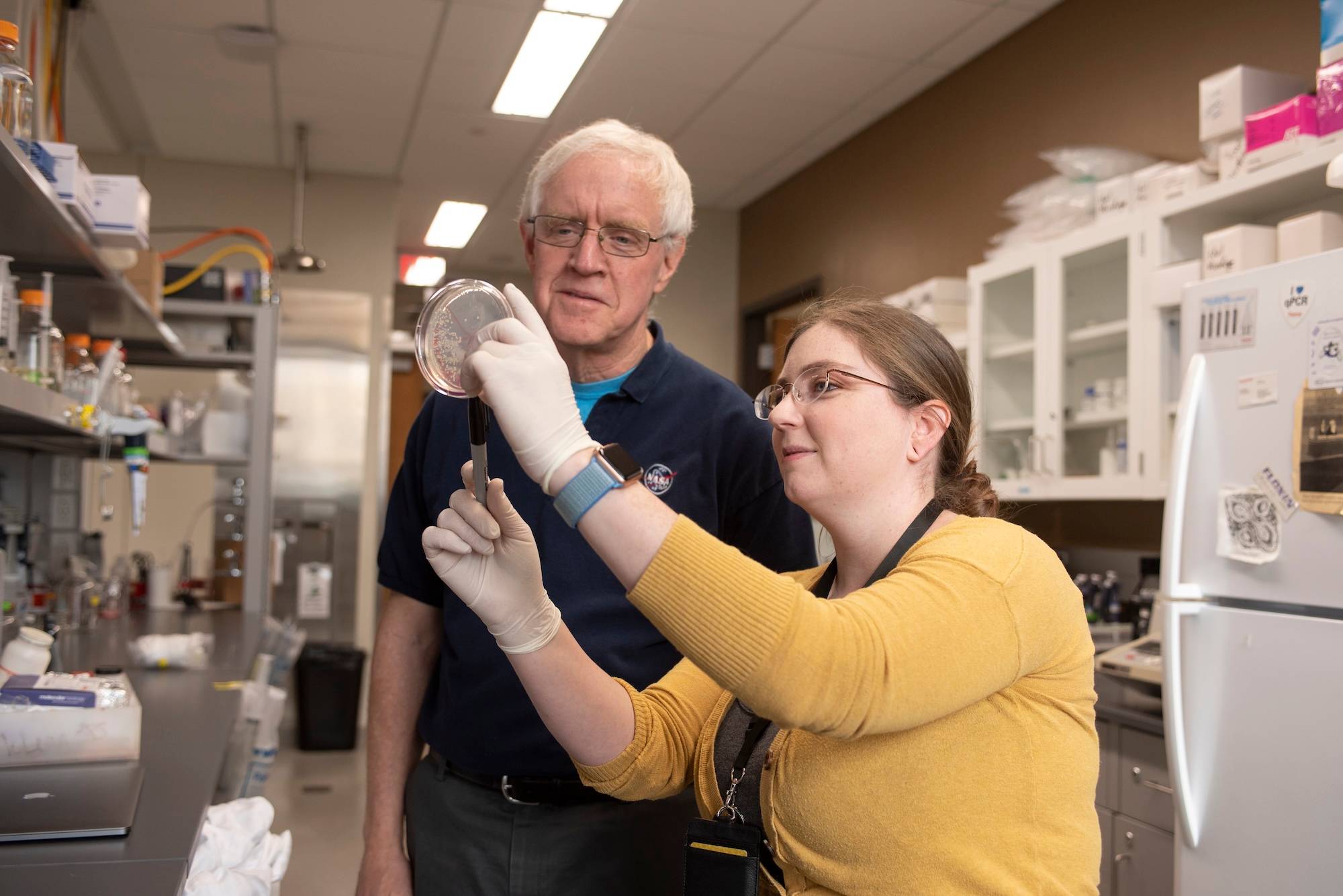 Student and professor working in a lab