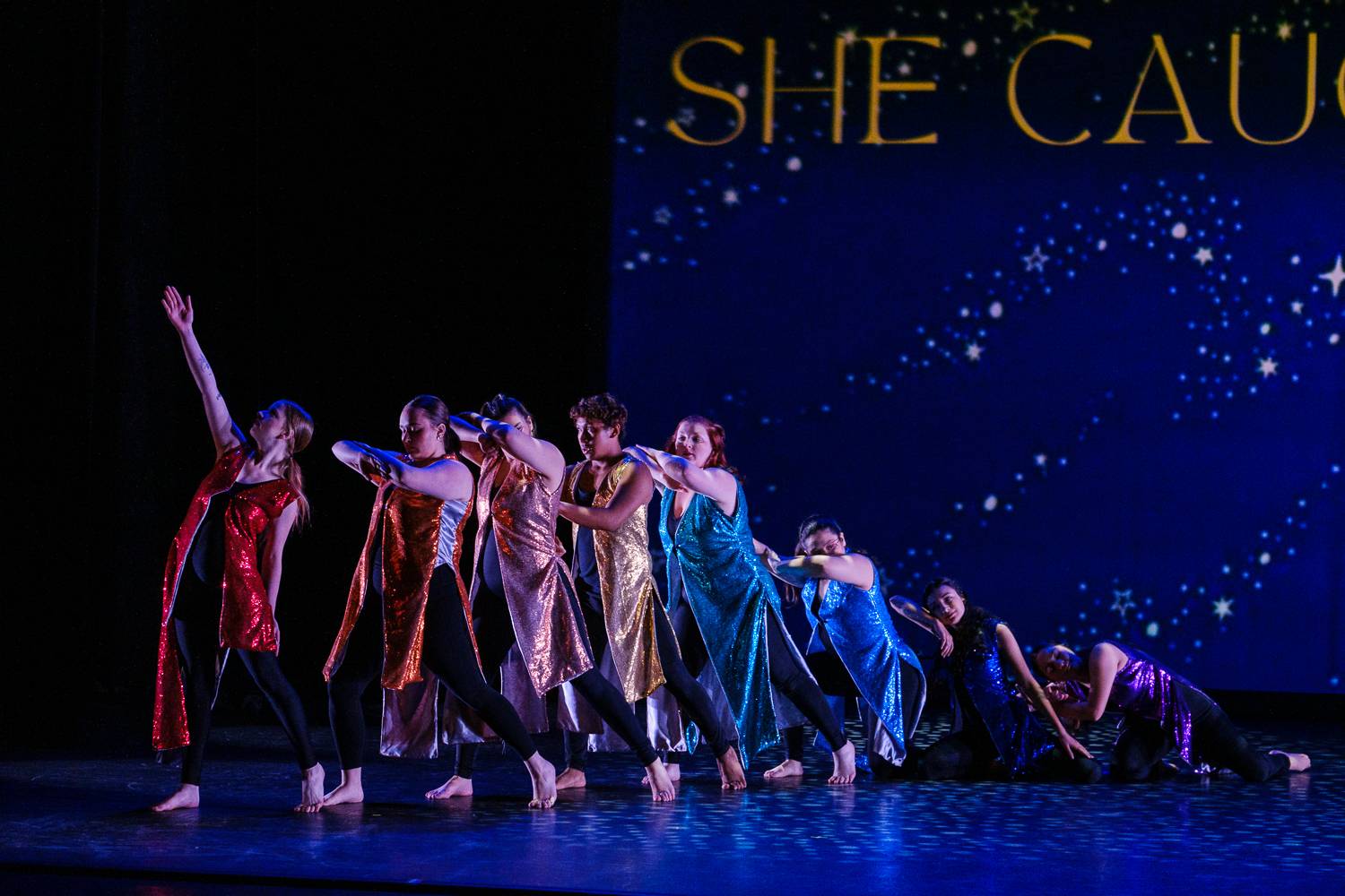 Students dancing on the stage of the performing arts center