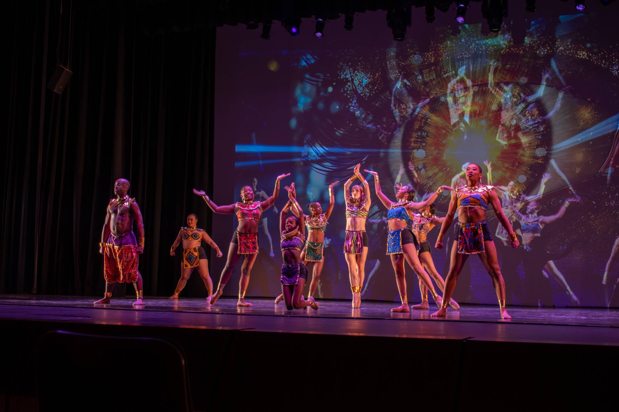 Performers dancing in Evans Auditorium 