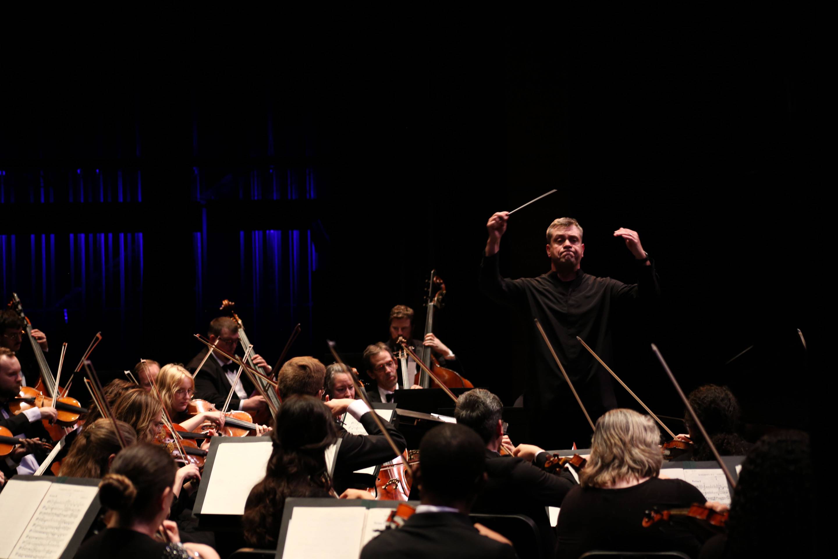 Music students performing a piece. 