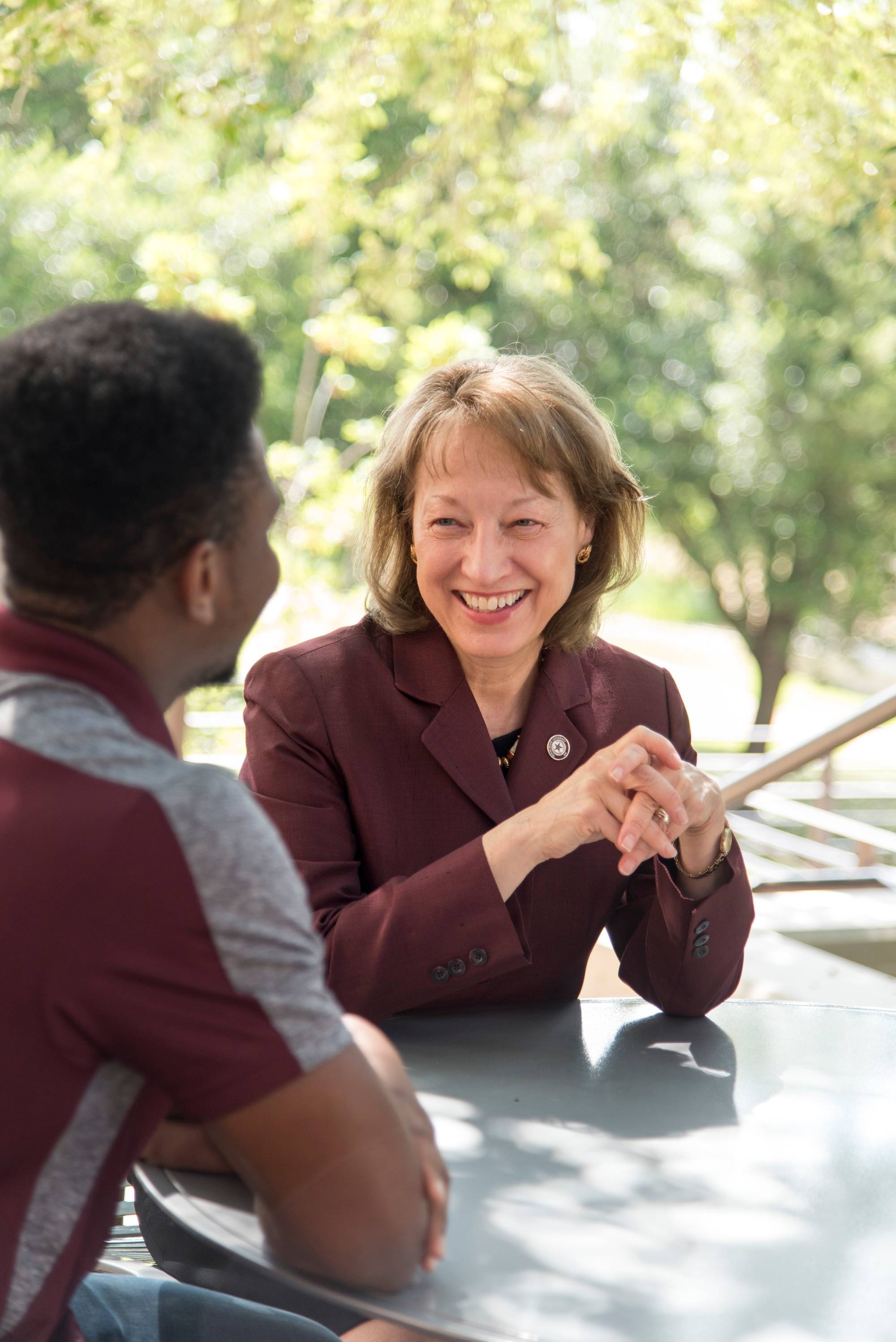 Dr. Trauth talking to a student