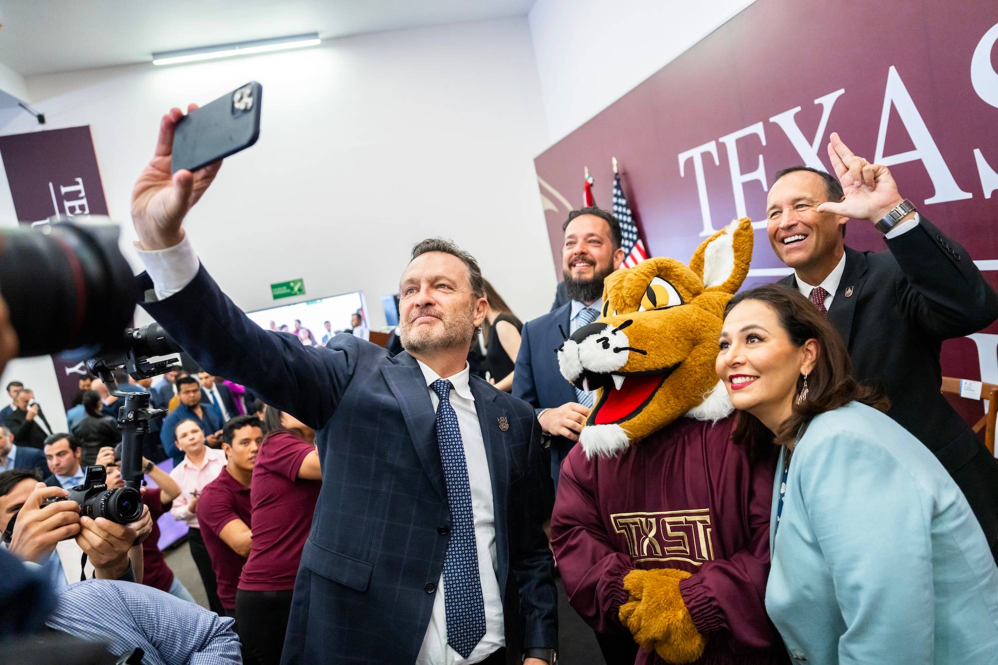 President Damphousse taking selfie with colleagues at the Mexico campus