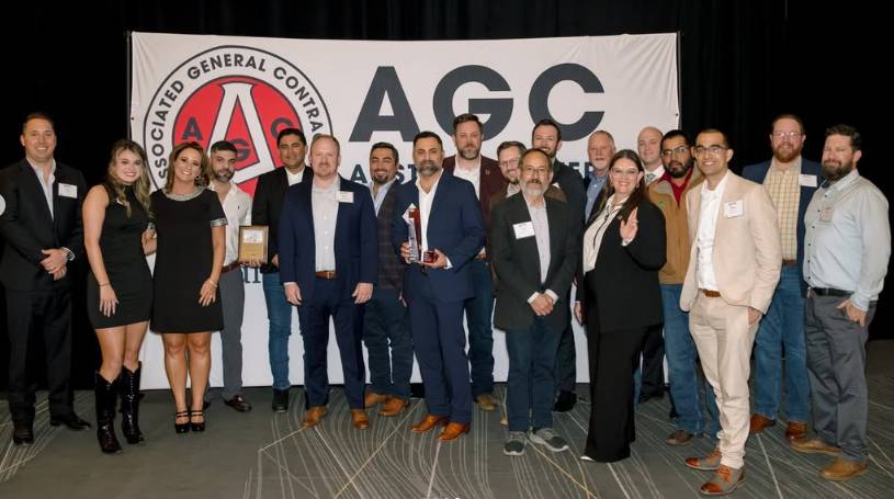 Members of SpawGlass and Texas State receive the award