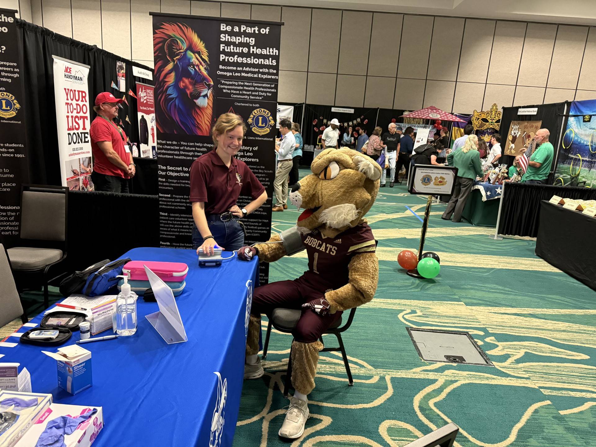 Measuring BOKO's blood pressure at the San Marcos Business Expo