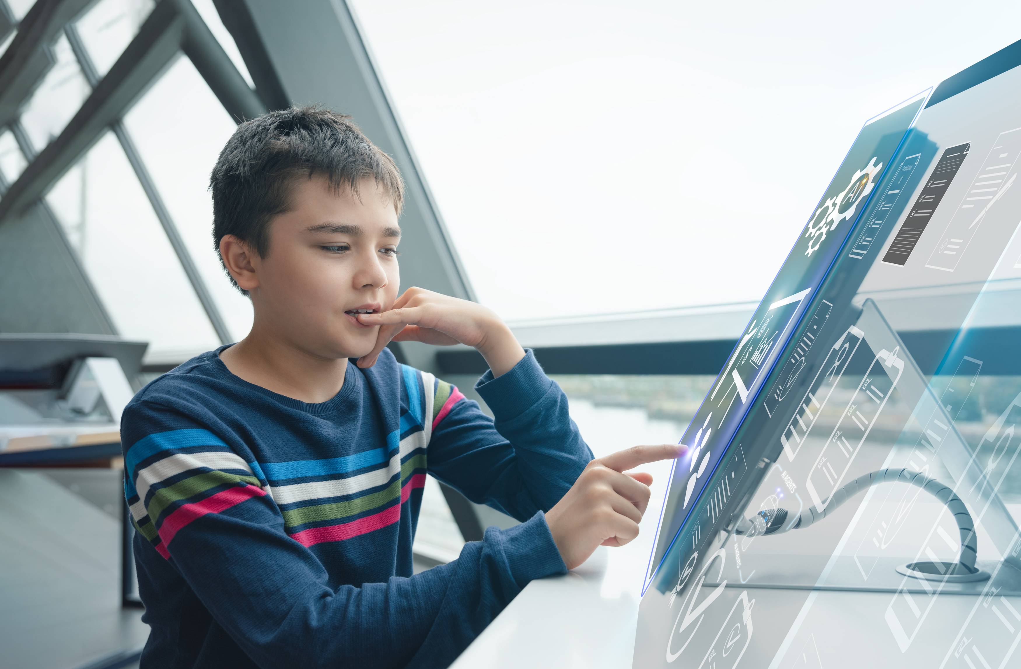 a child uses a futuristic computer