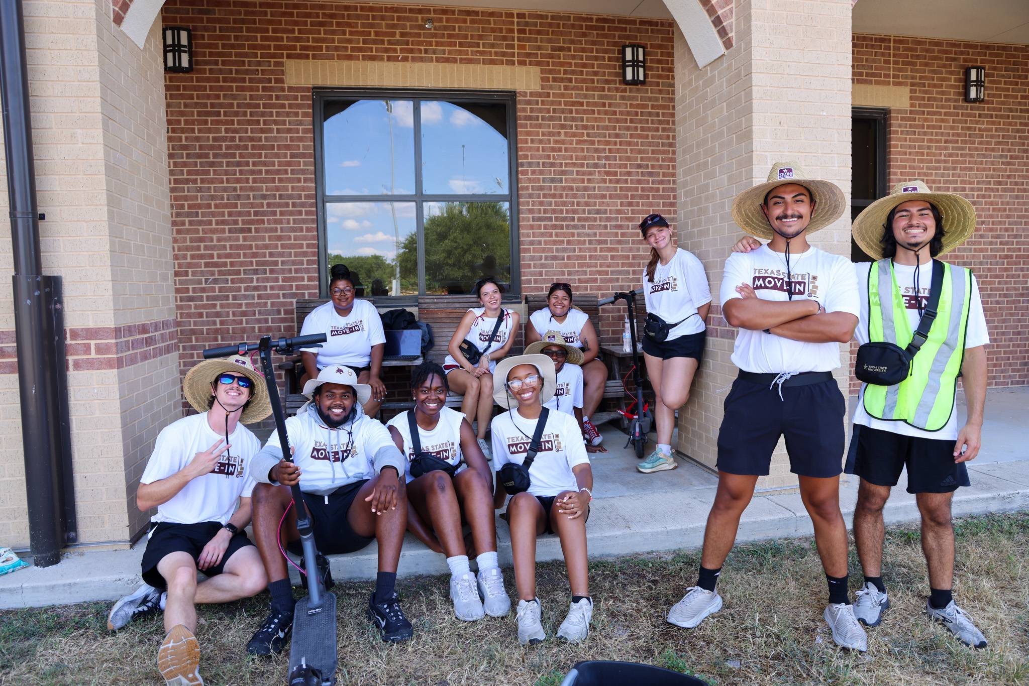 students standing in matching white move-in shirts 