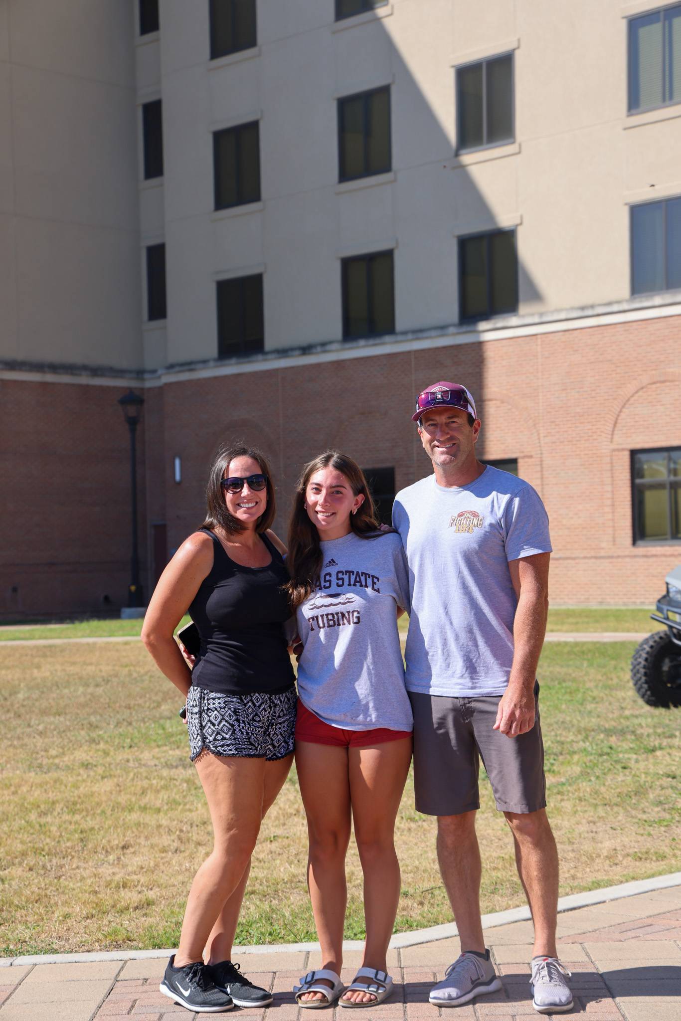 student and parents outside of residence hall