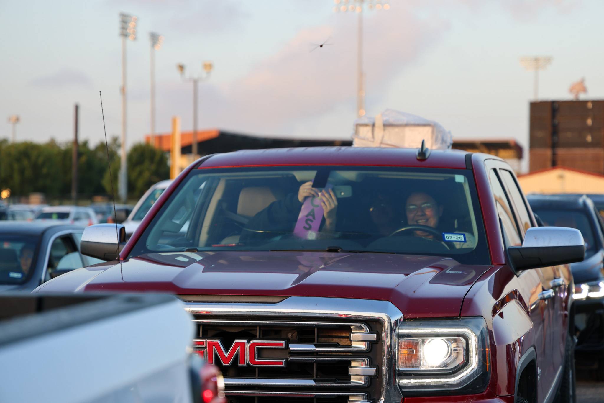 GMC hanging their move-in hang tag at the move-in lot