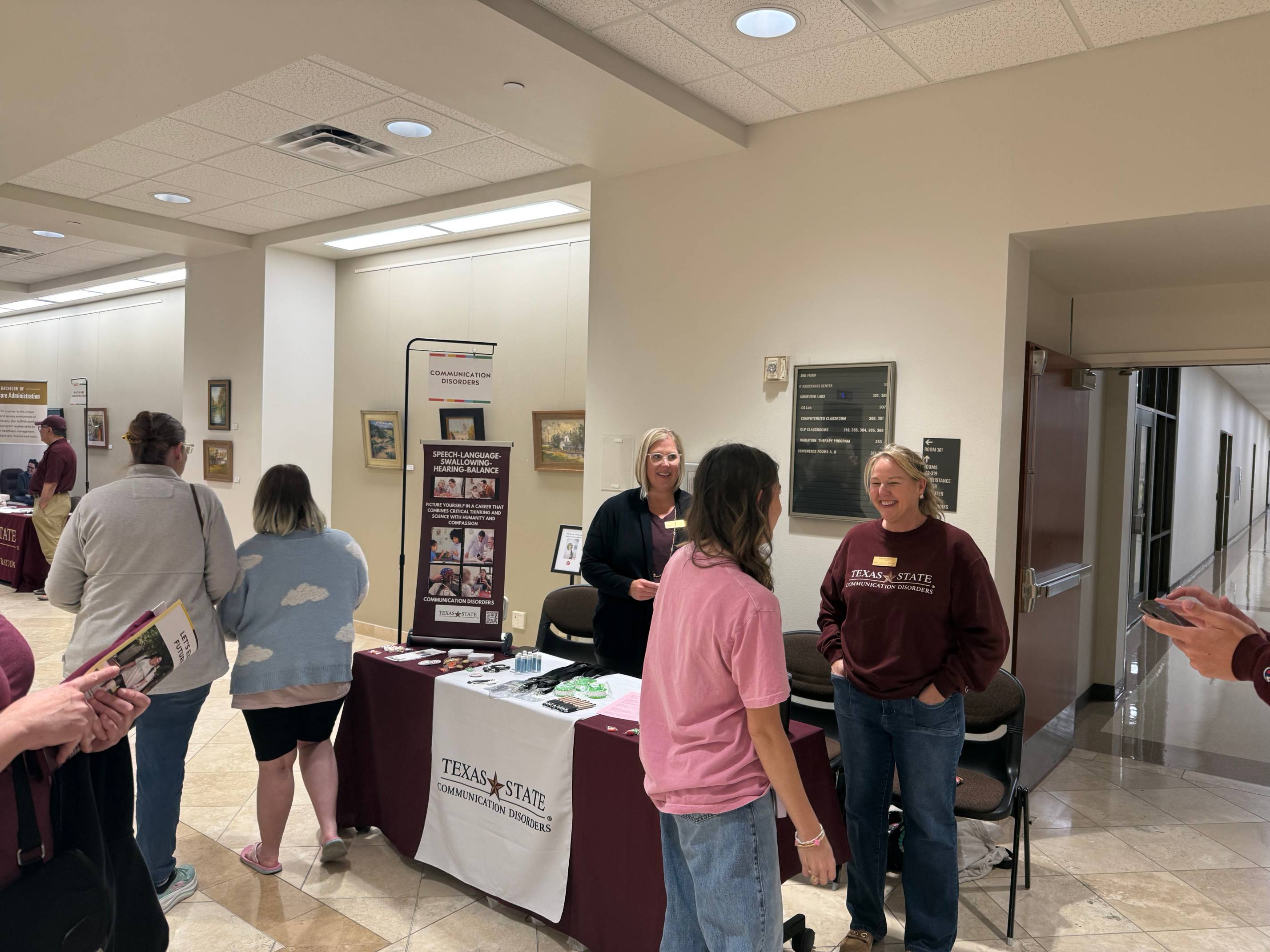Ms. Rasmussen and Ms. Lesieur giving out SWAG and information about our Department.