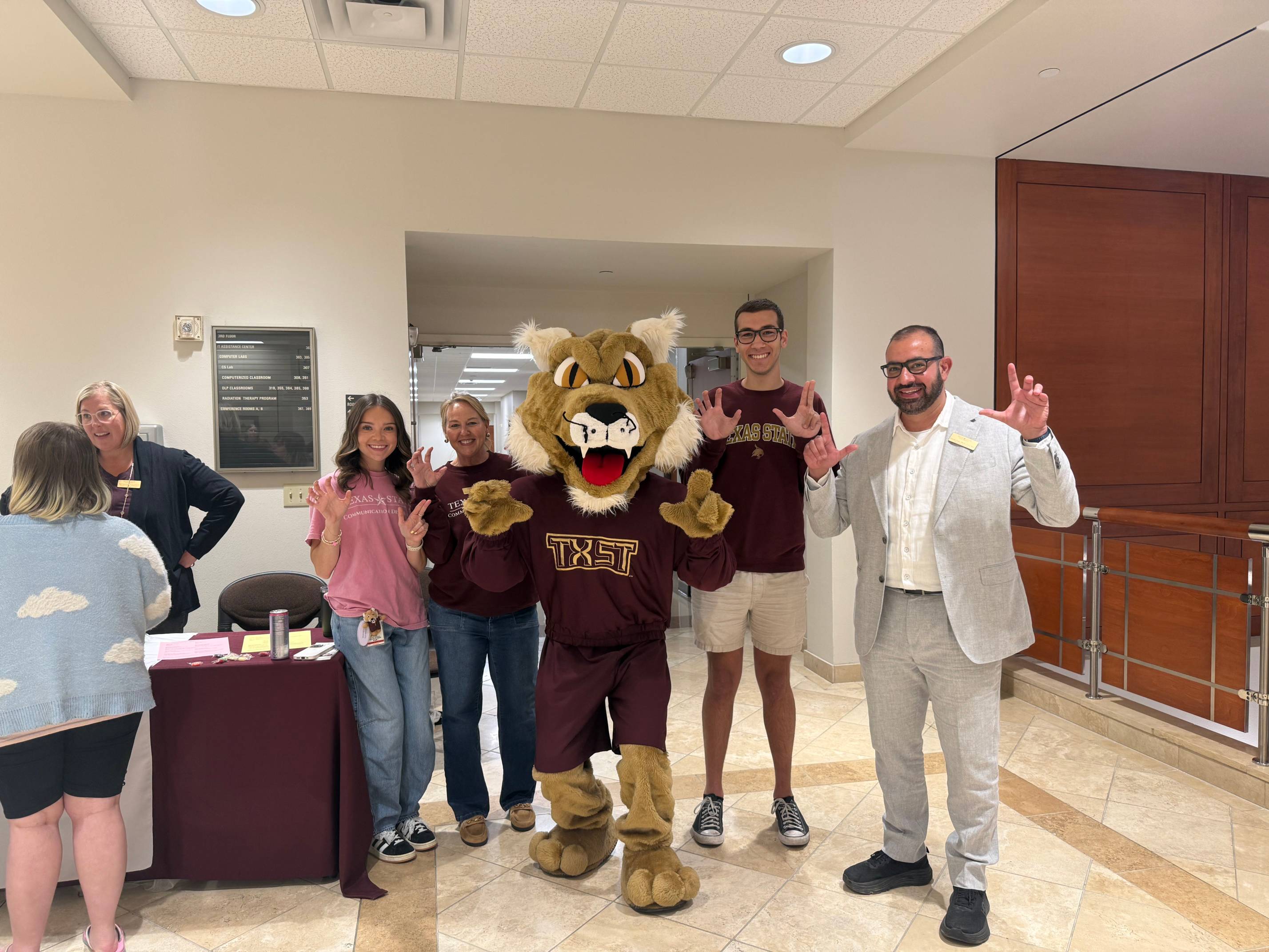 Ms. Beth Rasmussen, Ms. Stacey Lesieur, Dr. Farzan Irani, some TXST students standing next to Boko.