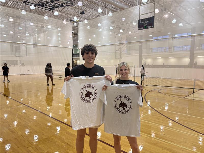 Intramurals champions from corec pickleball doubles league pose with shirt