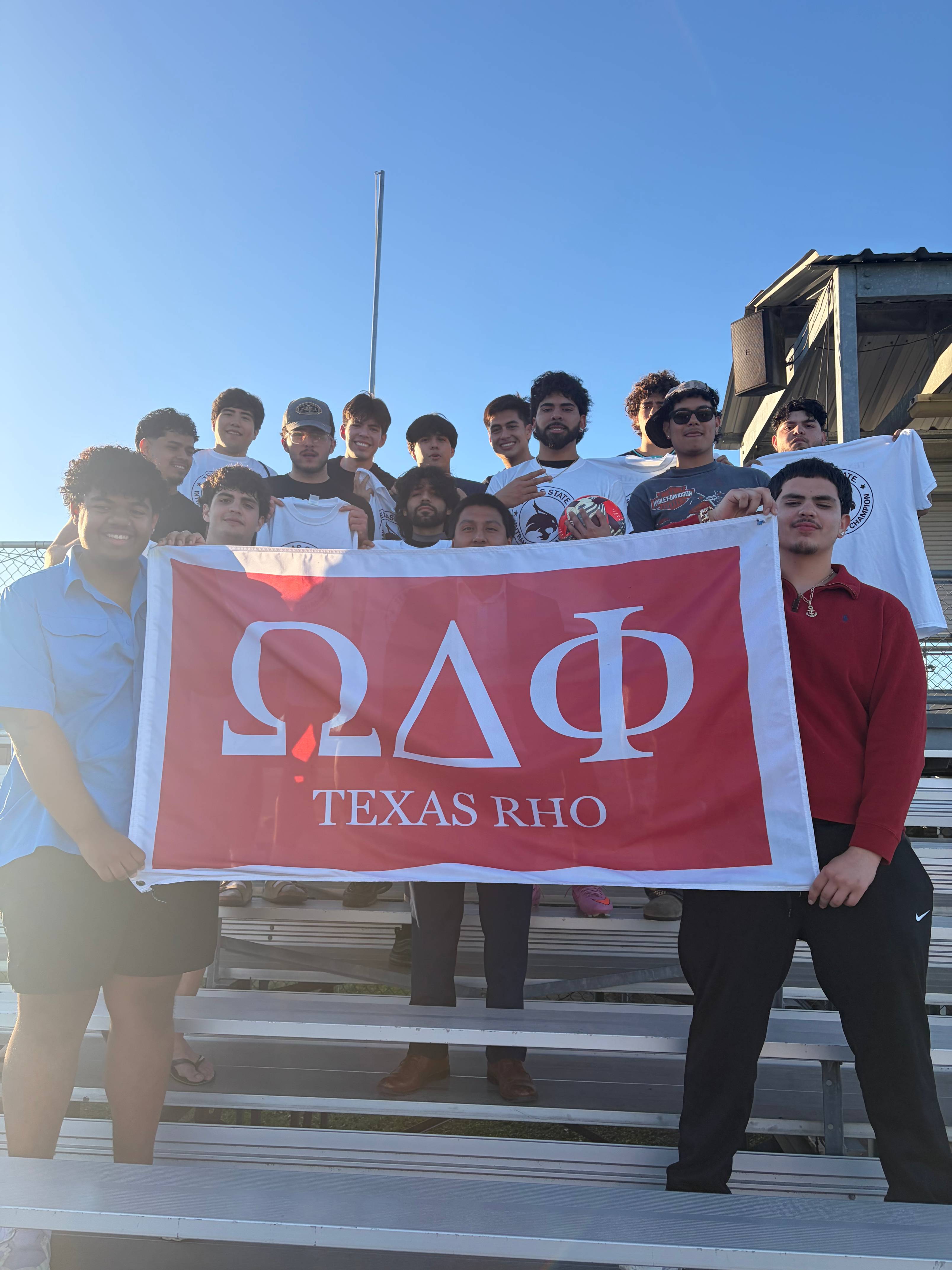 Intramurals champions from fraternity soccer league pose with shirt