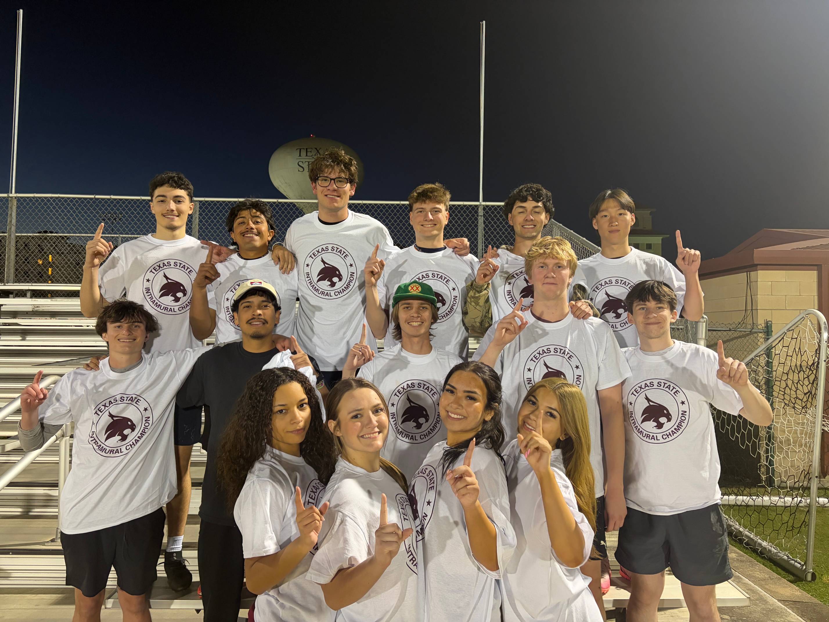 Intramurals champions from corec soccer league pose with shirt