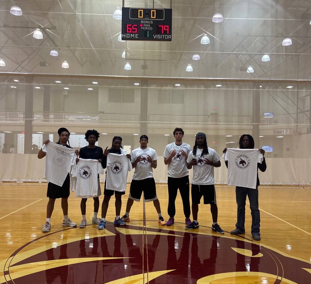Intramural champs pose with photos after win