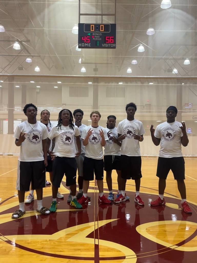Intramural champs pose with photos after win
