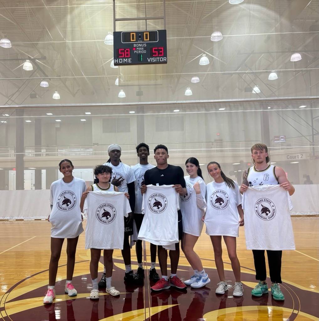 Intramural champs pose with photos after win