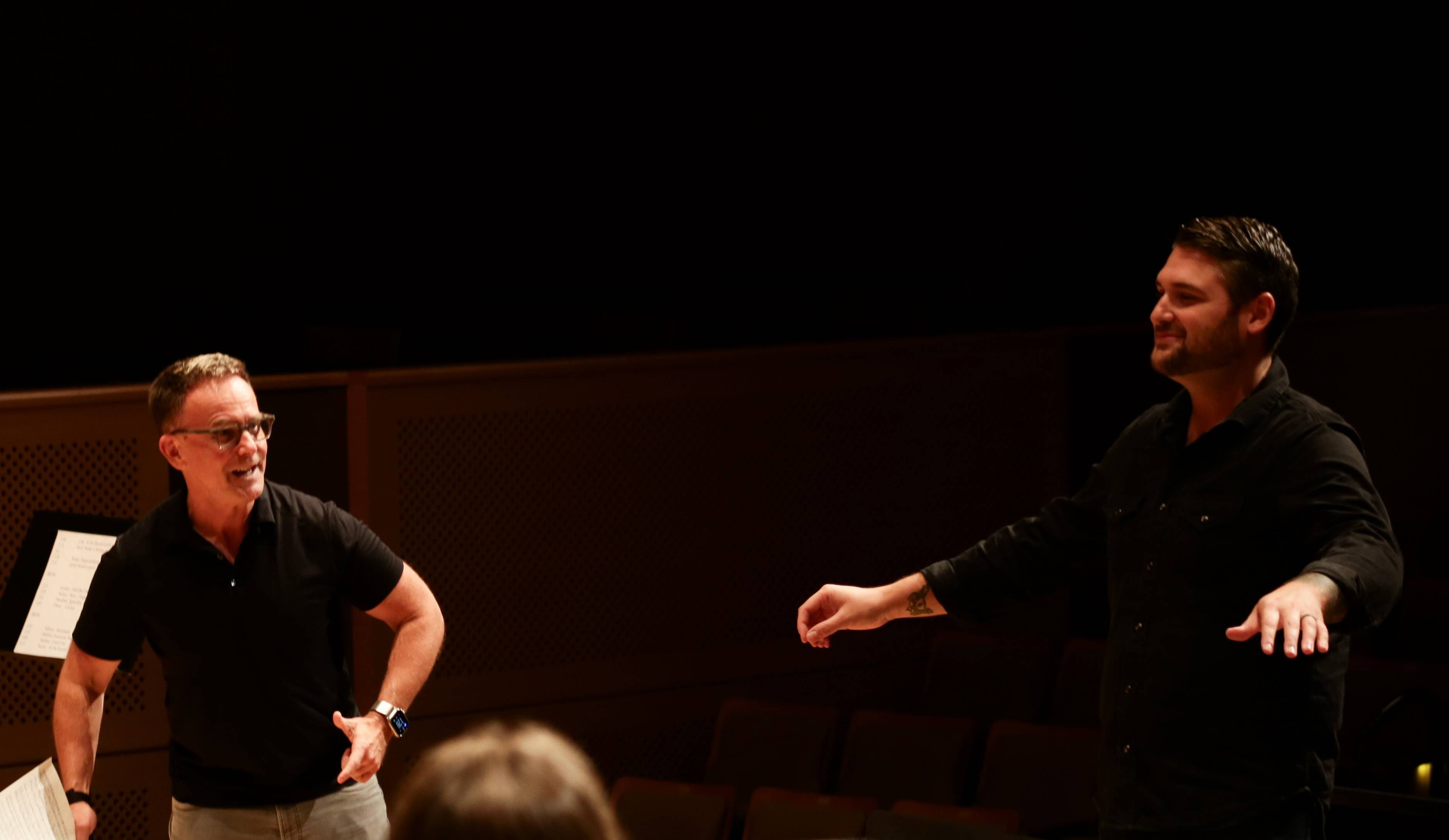 Craig Hella Johnson coaches a symposium student. 