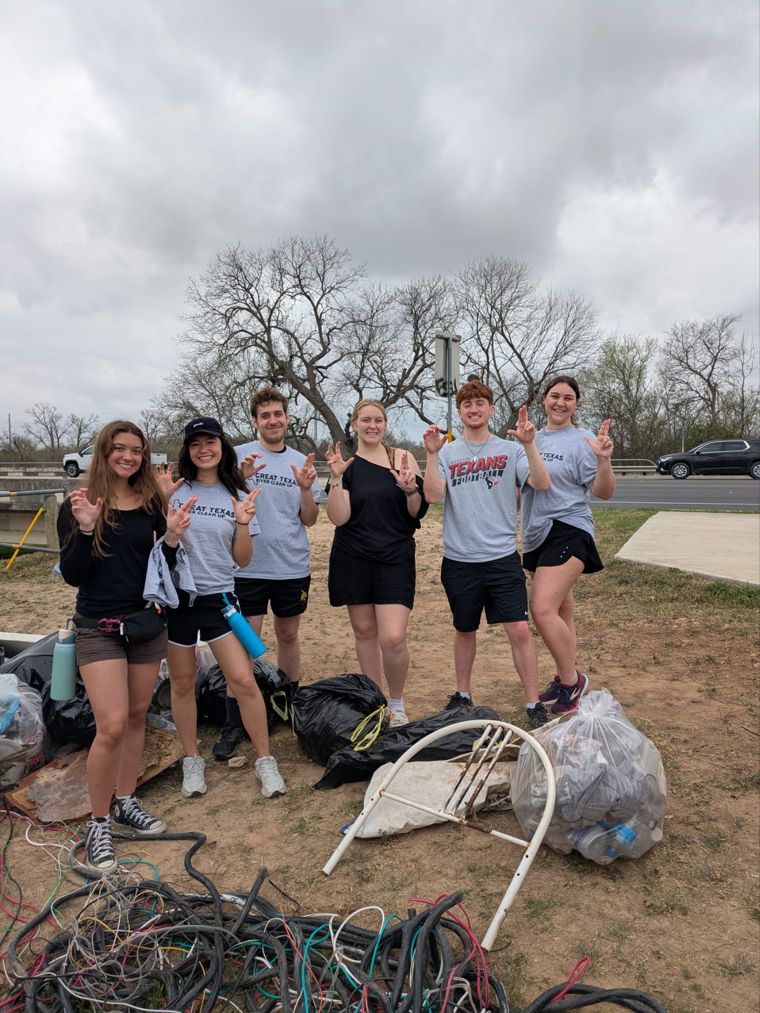 Six McCoy Ambassadors volunteering at a River Clean Up
