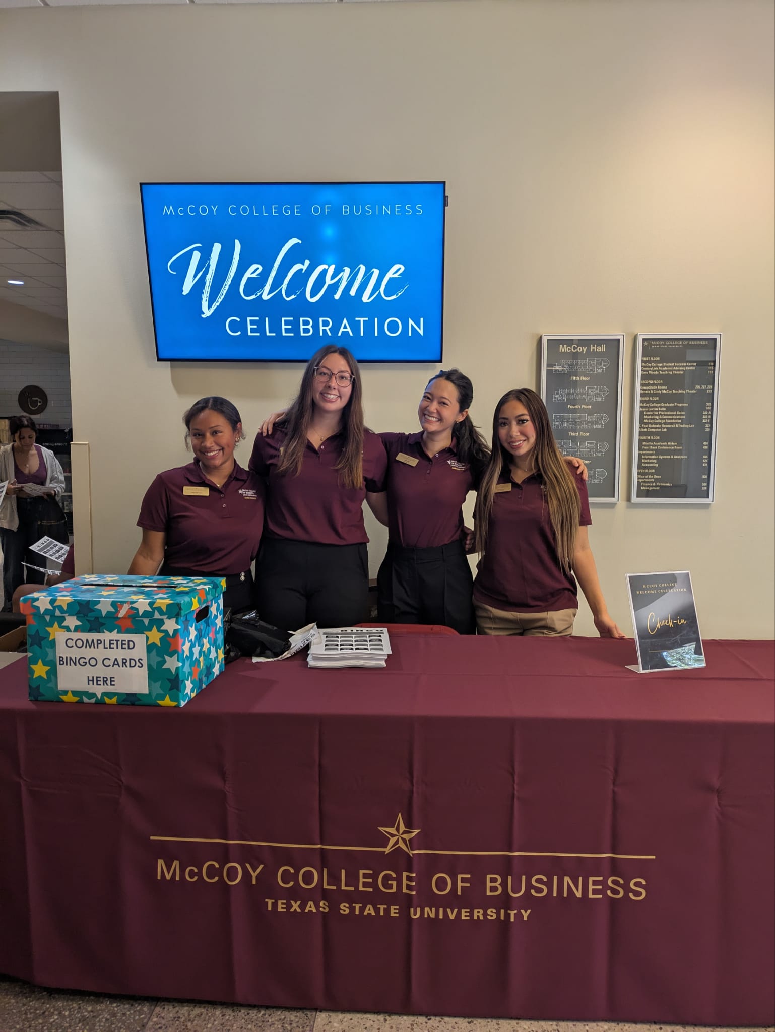 Four McCoy Ambassadors tabling at the McCoy Welcome Celebration