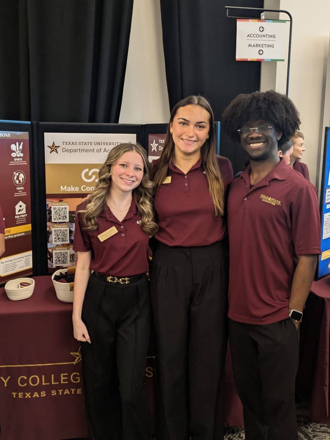 Three McCoy Ambassadors tabling at Bobcat Day in the LBJ Grand Ballroom Majors Fair