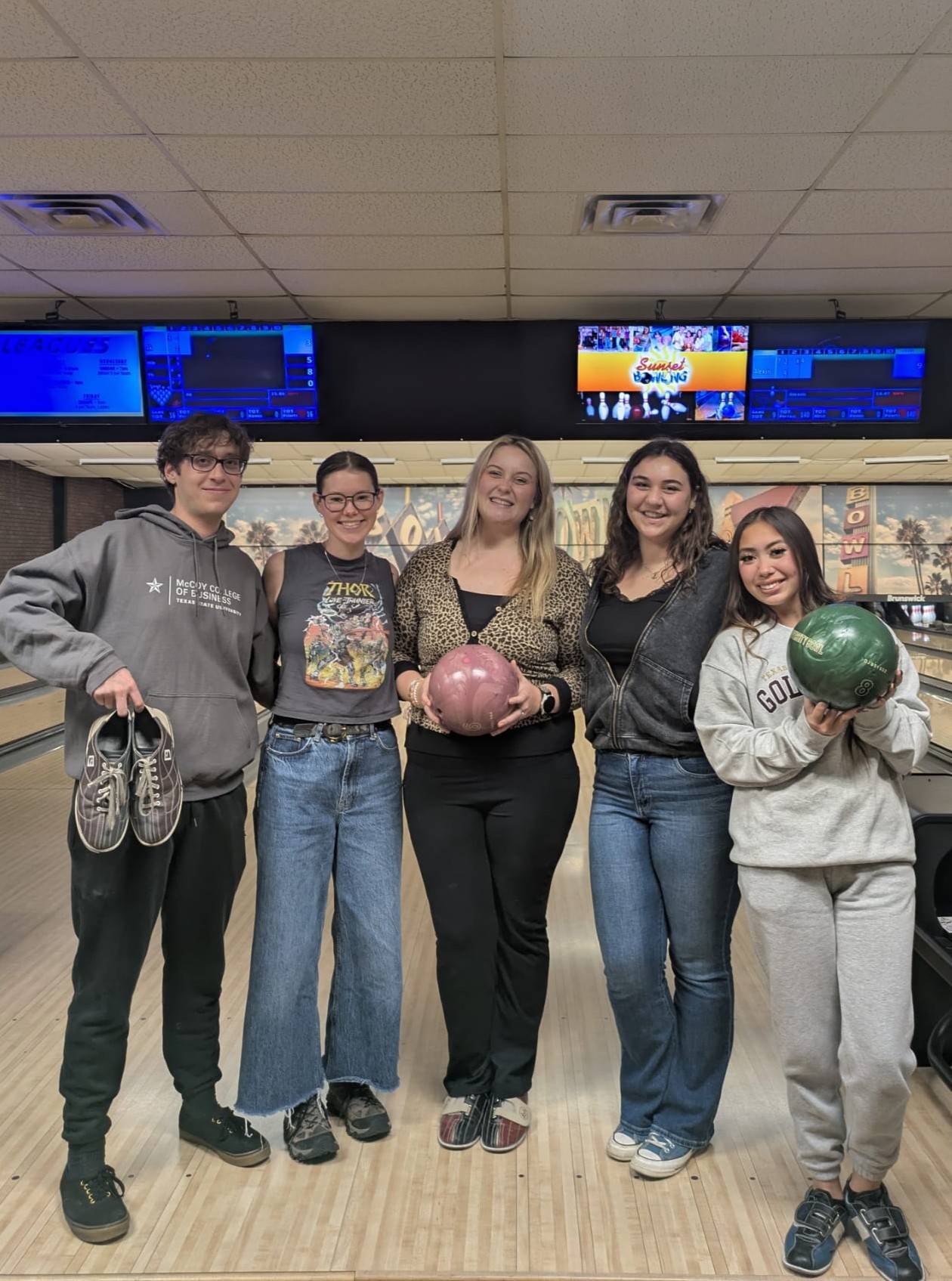 Five McCoy Ambassadors at a bowling alley