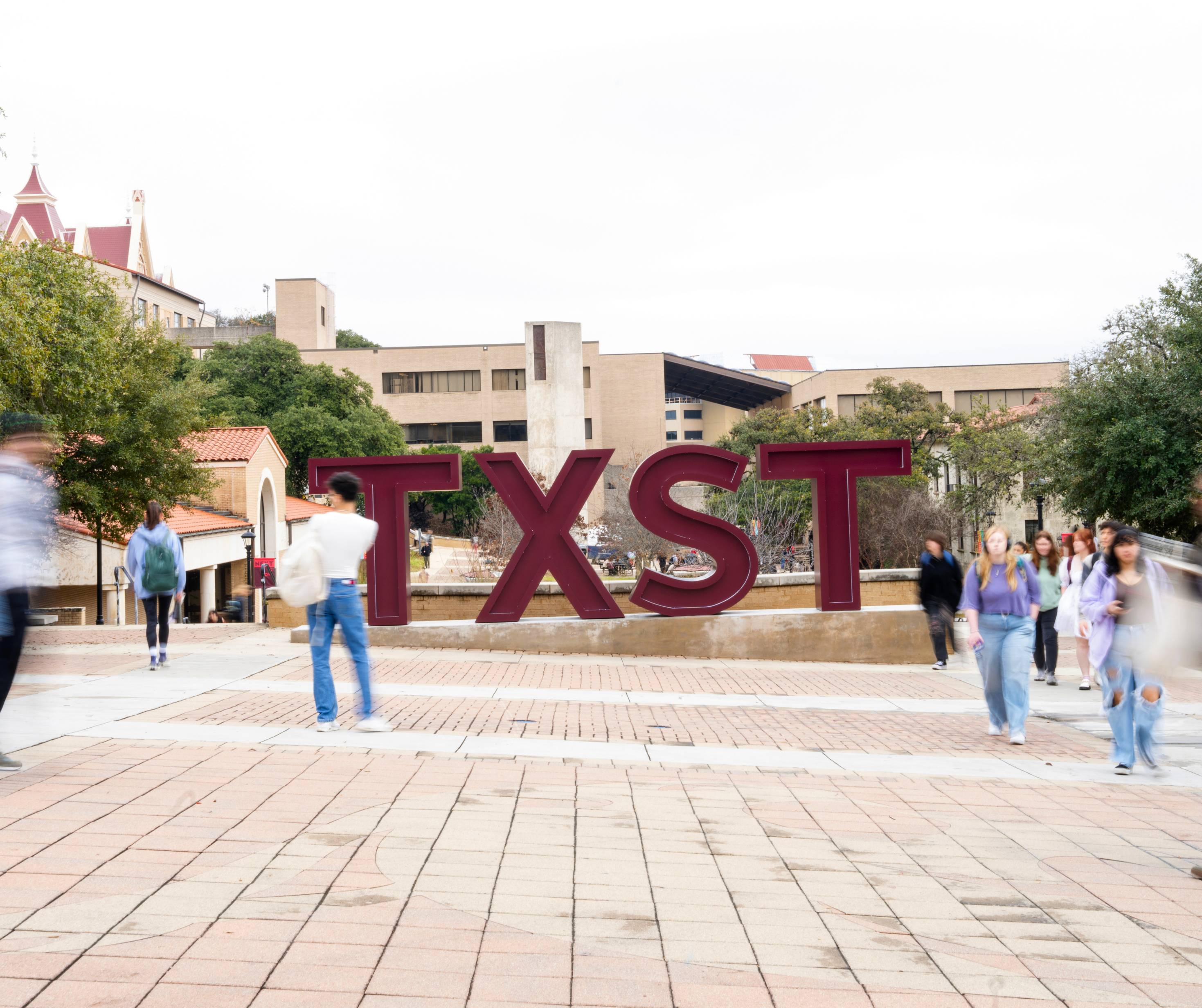 students on the txst campus in summer