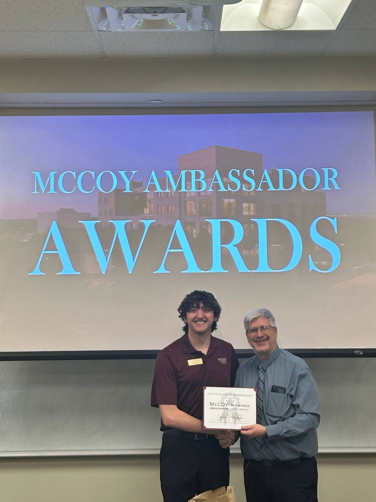 A McCoy Ambassador and Associate Dean Dr. Wierschem at the Ambassador Banquet