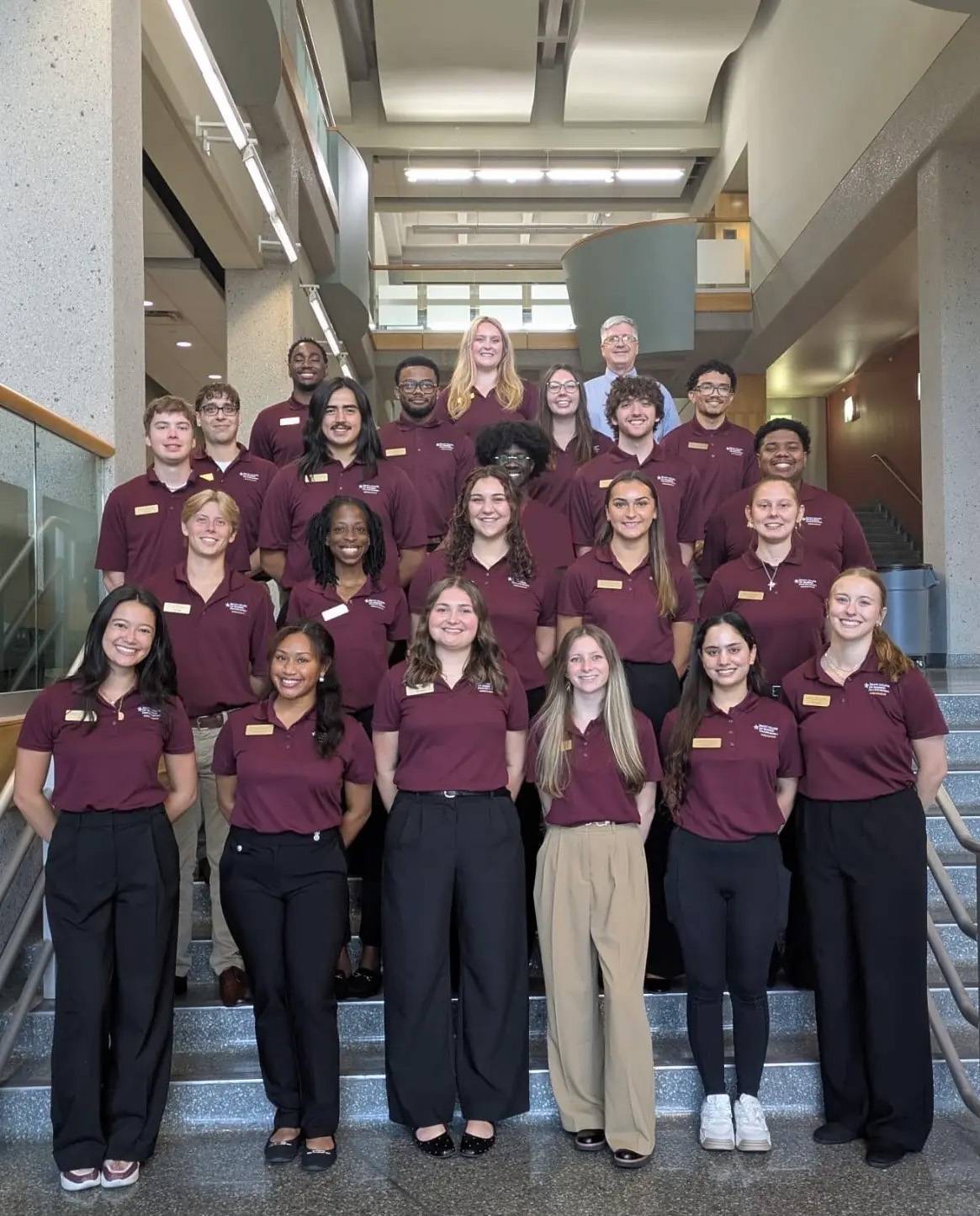 McCoy Ambassadors standing as a group on the McCoy stairs